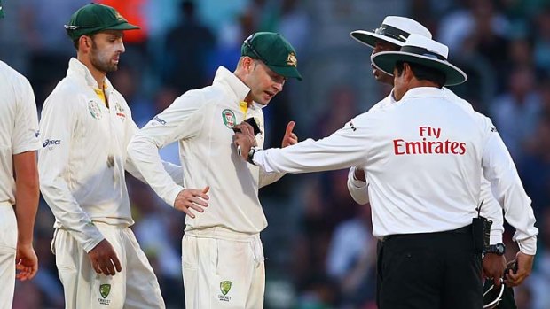 Michael Clarke remonstrates with umpire Aleem Dar before bad light ended the final Test.