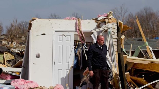 Carnage ... a man stands by the debris from the home of his mother-in-law.