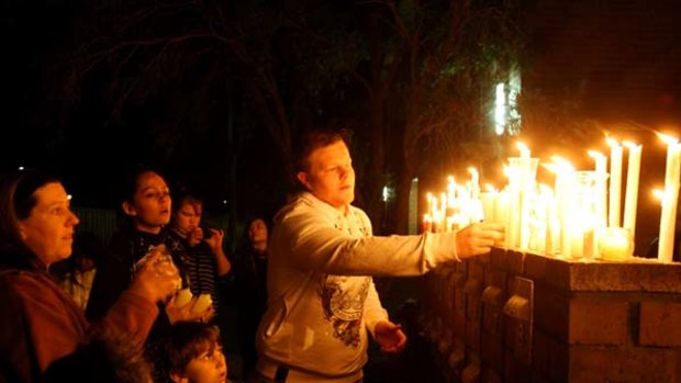 Members of the public light candles for Kiesha Abrahams.