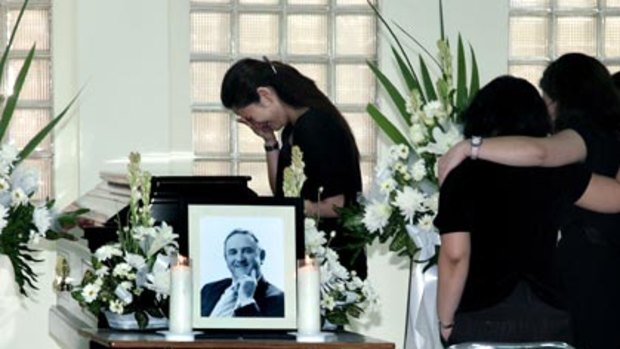 Saying  goodbye ... Indonesian friends and colleagues pay their respects to Thiess executive Garth McEvoy during a service at a Jakarta hospital yesterday. The Brisbane man was  one of nine people killed  including three Australians  in the Jakarta bombings five days ago.