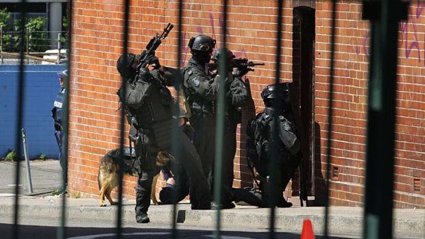 Heavily armed police stormed a building during a siege in Leichhardt.