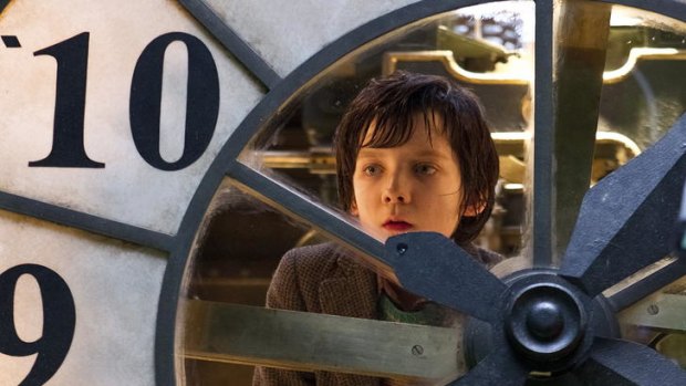Hugo (Asa Butterfield) in the train station that becomes his life.