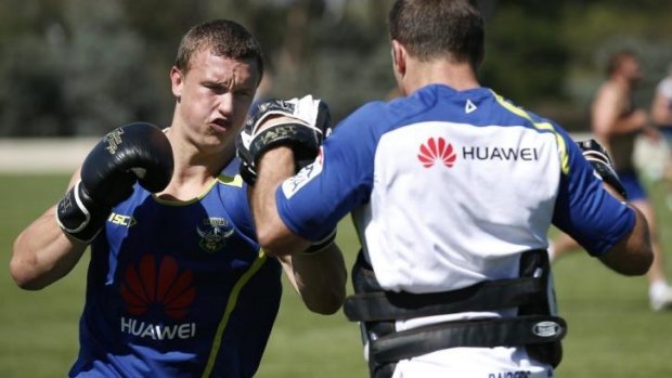 Canberra Raiders player Jack Wighton, left, boxing during pre-season training at Raiders headquarters.