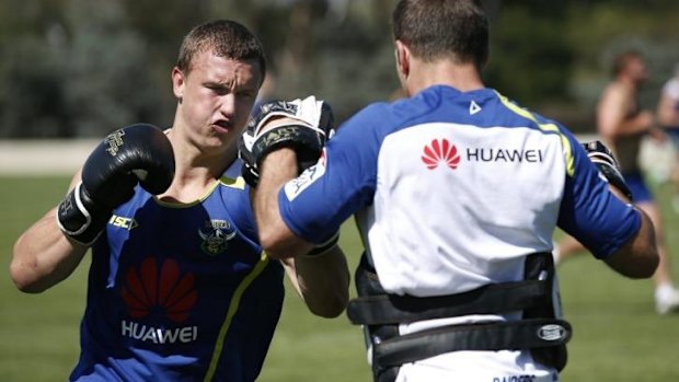 Canberra Raiders player Jack Wighton, left, boxing during pre-season training at Raiders headquarters.