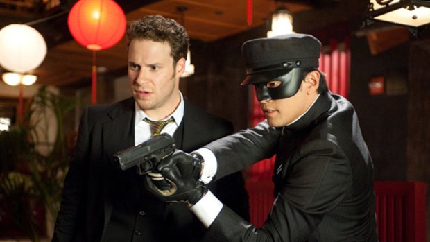 Show me again, but in 3D: The Green Hornet (Seth Rogen, left) gets his driver Kato (Jay Chou) to demonstrate how guns work in the exceedingly average action-adventure comedy The Green Hornet.