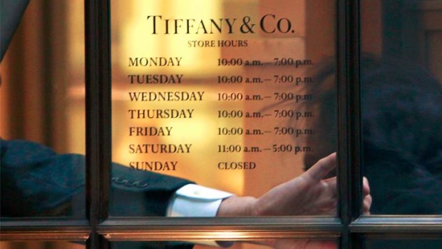 An employee arrives for work at theTiffany & Co. store on Wall St. in New York's financial district.