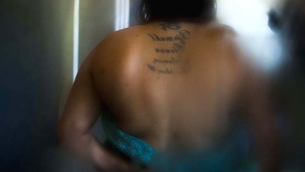 Gillianne has tattoos of her children's names on her back.