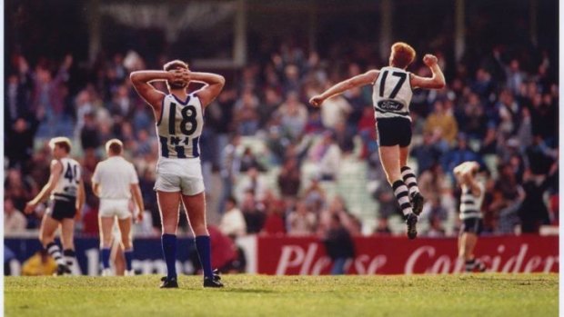 Geelong's Tim McGrath celebrates the after-the-siren goal by Gary Ablett while North Melbourne's Wayne Carey looks on.