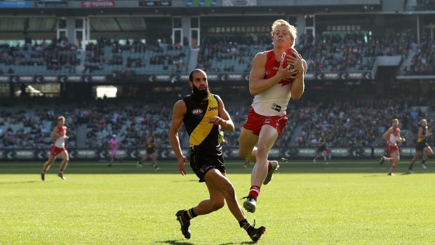 Salvage mission: Isacc Heeney in action for the Swans. 