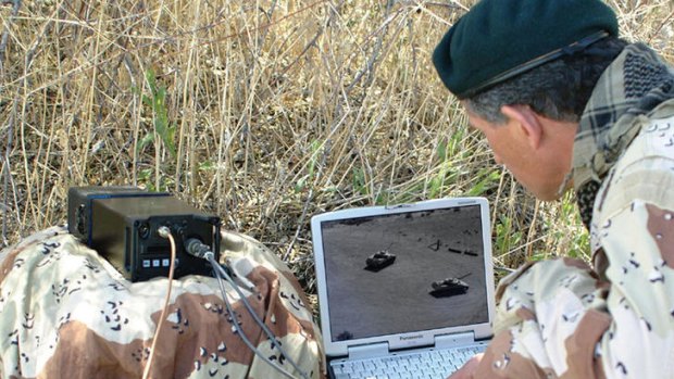 An unidentifed US soldier monitors a live video feed from an aerial source. Australian companies no longer need export licences to sell to the US military.