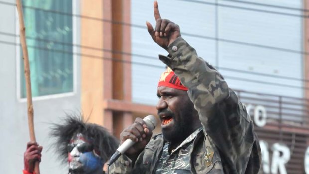 A Papuan protester addresses a crowd.