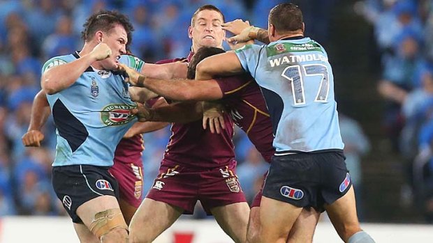 Hitting out: Paul Gallen swings at Nate Myles.