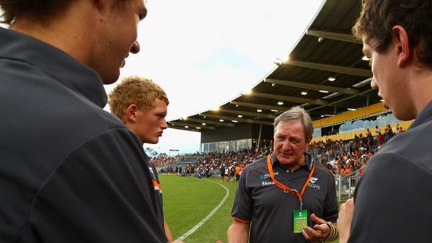 Back in town: Kevin Sheedy addresses the Giants before their 79-point loss to the Swans last night.