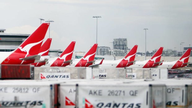 Qantas has won a victory in its long-running dispute with baggage handlers after the industrial umpire rejected their claim for a limit to the outsourcing of work.