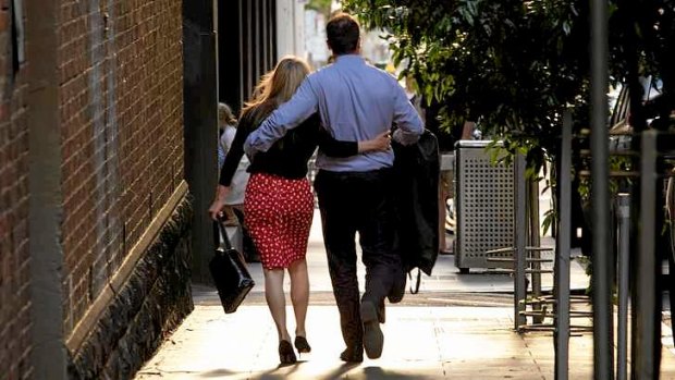 Frankston MP Geoff Shaw leaving Parliament with a blonde woman.