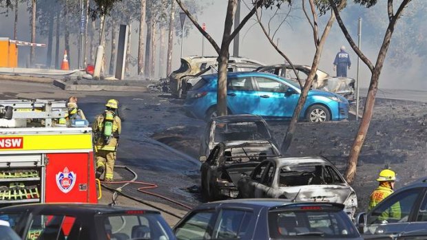 Inferno: several cars caught fire in the carpark of the Aquatic Centre at Olympic Park on Sunday.