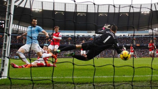 Manchester City's Alvaro Negredo scores past Arsenal's Wojciech Szczesny last December.