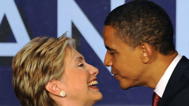 Kiss and make up: Hillary Clinton and Barack Obama put on their show of unity at the "Women for Obama" breakfast in New York.