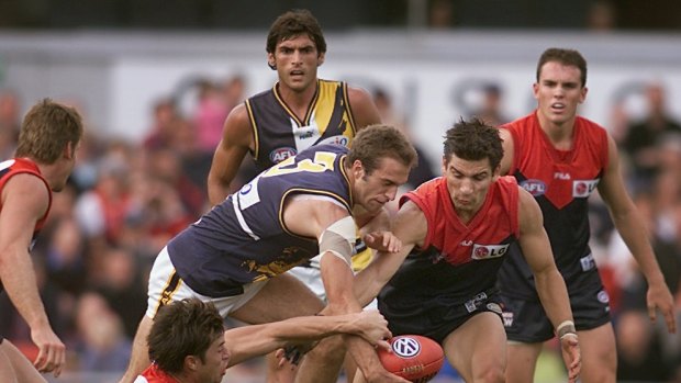 Chris Judd in Melbourne traffic at what was known as Optus Oval in 2002.