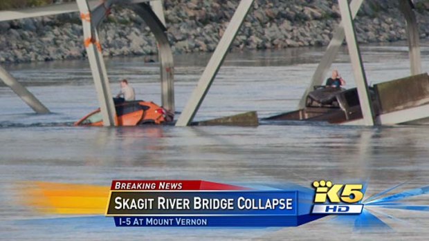 Plunge: people sit on their vehicles in the river.