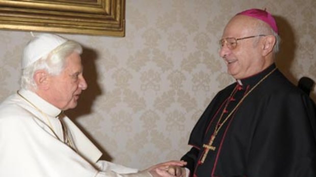 Pope Benedict XVI is greeted by Archbishop Robert Zollitsch (right) during a meeting at the Vatican.