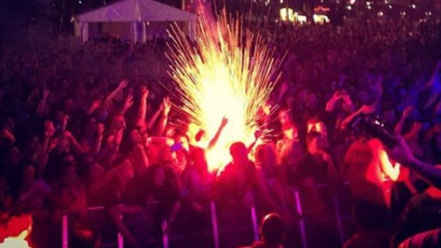 Three people suffered minor burns after a flare was lit during the Soundwave festival.