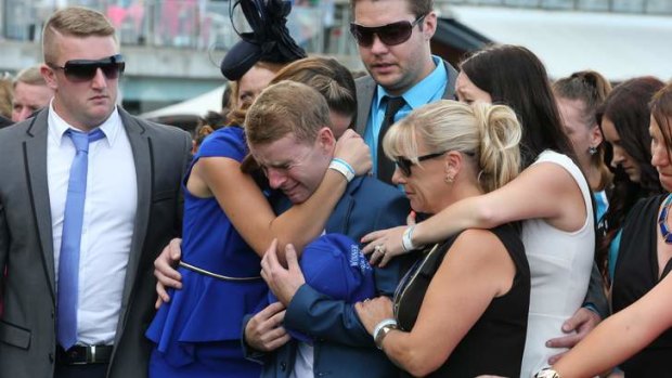 Family of late jockey Nathan Berry during the minute's silence.