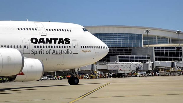 Qantas says market conditions and demand are the reasons why Australians pay far more to fly to the US than Americans pay to fly here.