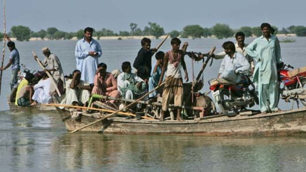 Pakistani flood survivors sail to safe areas in Dadu Moro near Sukkar, Pakistan.