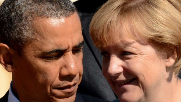 US President Barack Obama has been quizzed by German Chancellor Angela Merkel about whether her phone was tapped by US intelligence.