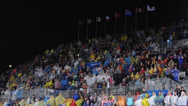 Crowds at the Pan Pacs copped a drenching in the un-roofed swim centre.