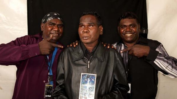 Winner . . . Geoffrey Gurrumul Yunupingu, centre, with his brothers Andrew and nigel backstage at the awards.