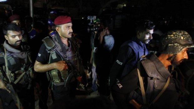 Pakistani commandos get ready to enter Karachi airport terminal following attacks by  gunmen.
