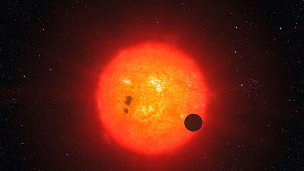An artist's impression shows how the newly discovered super-Earth GJ1214b surrounding the nearby star GJ1214 may look.