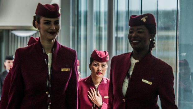 Qatar Airways crew disembark from the first plane to land in Canberra on its new daily Doha service.