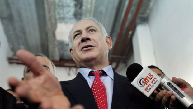 Likud Party leader Benjamin Netanyahu talks to reporters at the Likud headquarters in the southern Israeli city of Ashkelon.