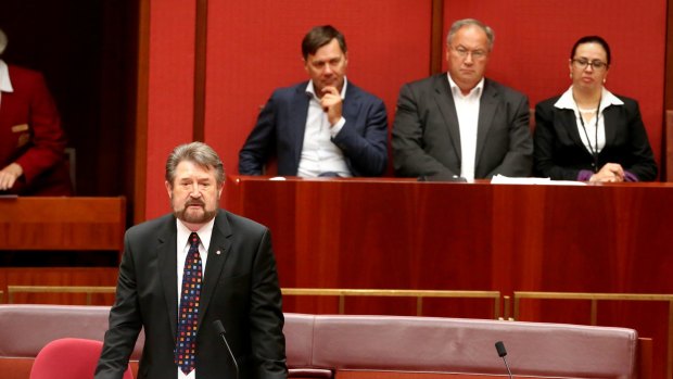 Derryn Hinch in front, as experienced crossbench advisers Glenn Druery, John Clements and Sarah Mennie watch behind in the Senate chamber.