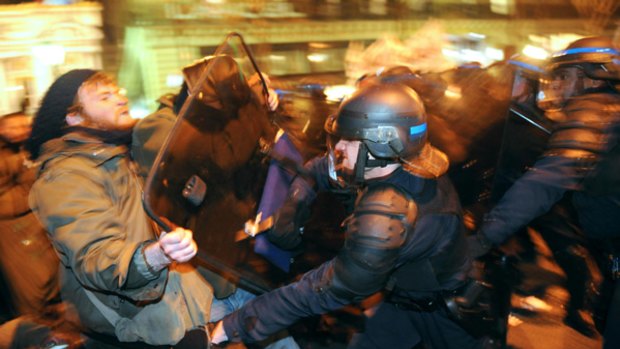 Police fight with demonstrators in Paris at the end of France's first major strike triggered by the global financial crisis.