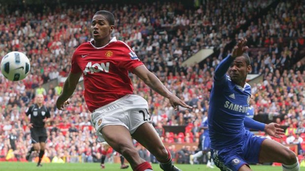 Back for more ... Antonio Valencia of Manchester United clashes with Chelsea's Ashley Cole.