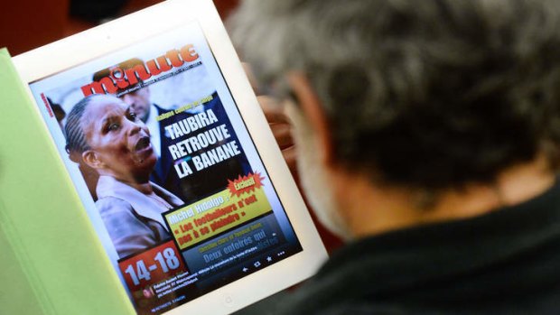 A reproduction of the front page of French far-right weekly magazine "Minute" with a picture of French Justice Minister Christiane Taubira.