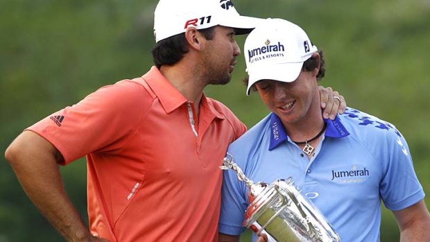 Australia's Jason Day and Northern Ireland's Rory McIlroy share a quiet moment after the Irishman charged to victory at the US Open.
