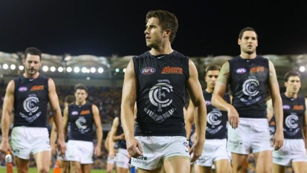 Marc Murphy leads the Carlton team off after a loss to the Lions on Saturday.