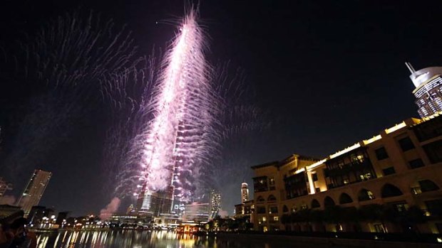 Fireworks illuminate the sky around Dubai's Burj Khalifa, the world's tallest building, after the Emirati city was chosen to host the World Expo 2020.