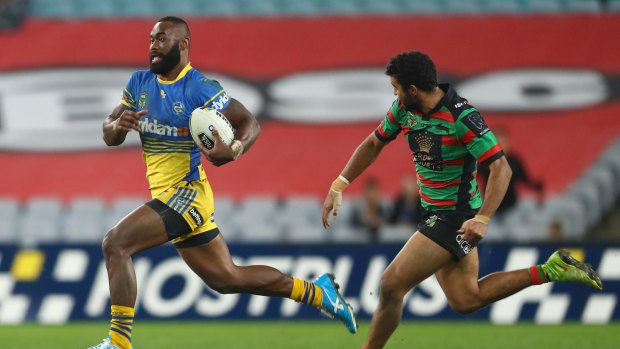 On the run: Semi Radradra breaks away to score a try during the round 15 NRL match between the South Sydney Rabbitohs and the Parramatta Eels at ANZ Stadium on Friday.