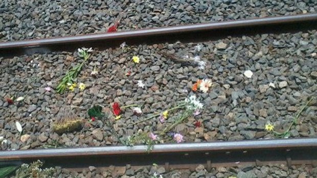 Flowers were placed on the tracks at Loganlea station for Jackson Doolan.