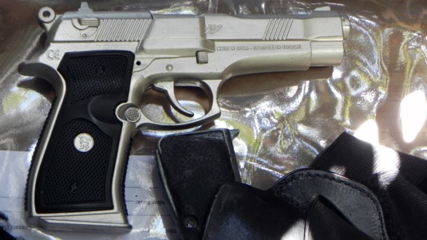 A replica firearm police seized during a raid on Friday.