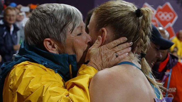 Winning team ... Sharon Hannan kisses Sally Pearson.