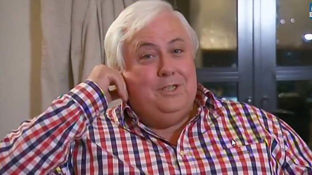 Going ... Clive Palmer prepares to walk out of an interview with Sarah Ferguson on <i>7.30</i>.