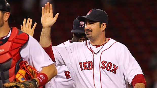 Adrian Gonzalez of the Boston Red Sox celebrates a 14-5 win over the San Diego Padres at Fenway Park on Tuesday. Josh Spence will play for the Padres in the second of the three-game series.