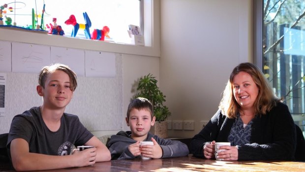 Aiden, 9, is already feeling the effects of hay fever on his asthma. He is pictured with his brother Patrick, 13, and mother, Belinda Smythe.